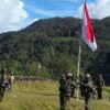 TNI Pengibaran Merah Putih di Kaki Gunung Cartenz Ugimba Papua